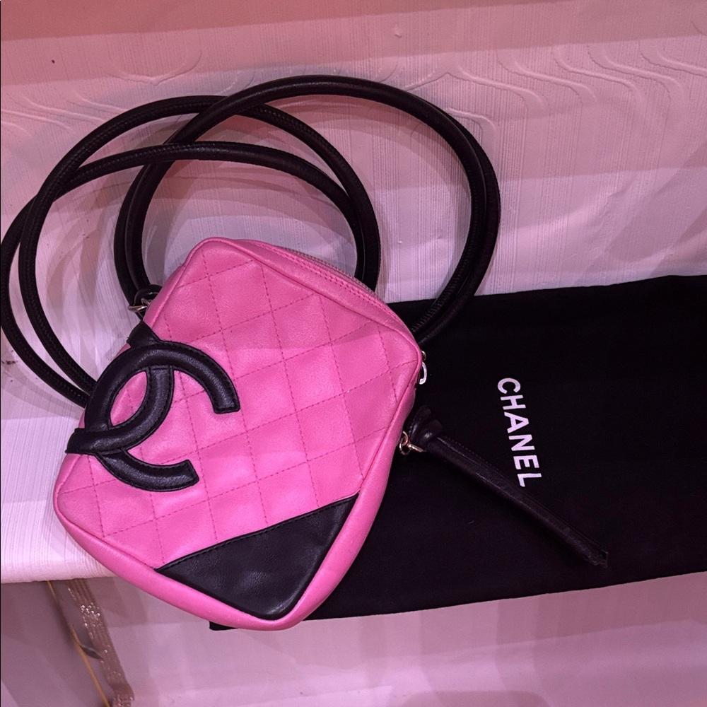CHANEL Pink Quilted Crossbody Bag with Black Trim and Logo